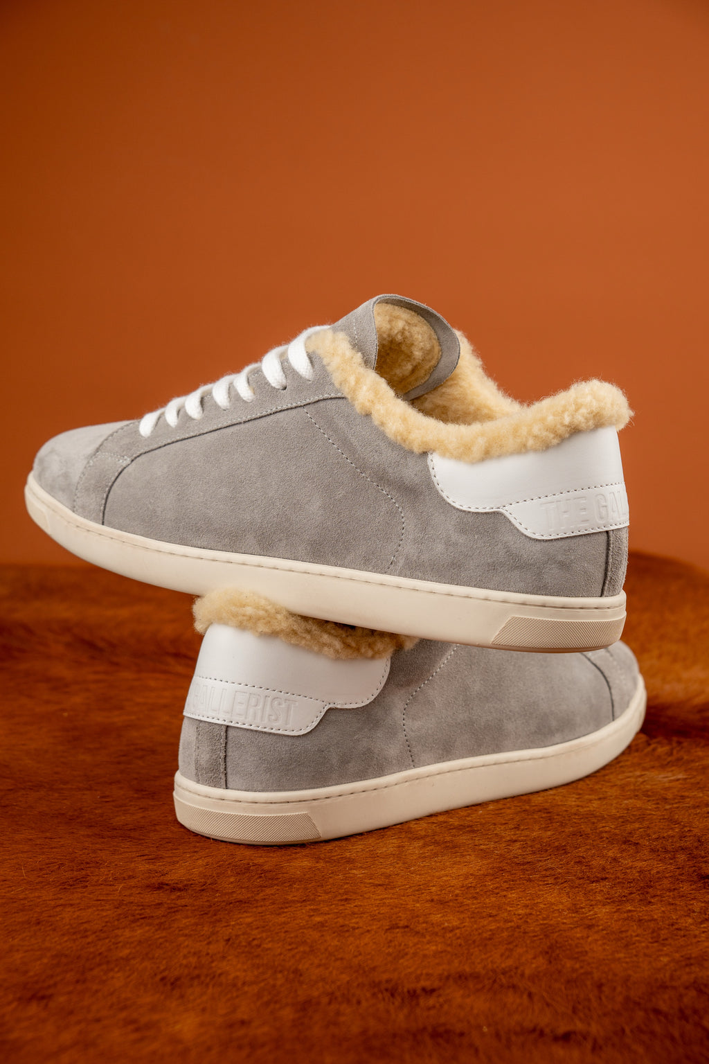 Geneva Wool Grey Suede Unsigned, pair stacked on cowhide, heel view