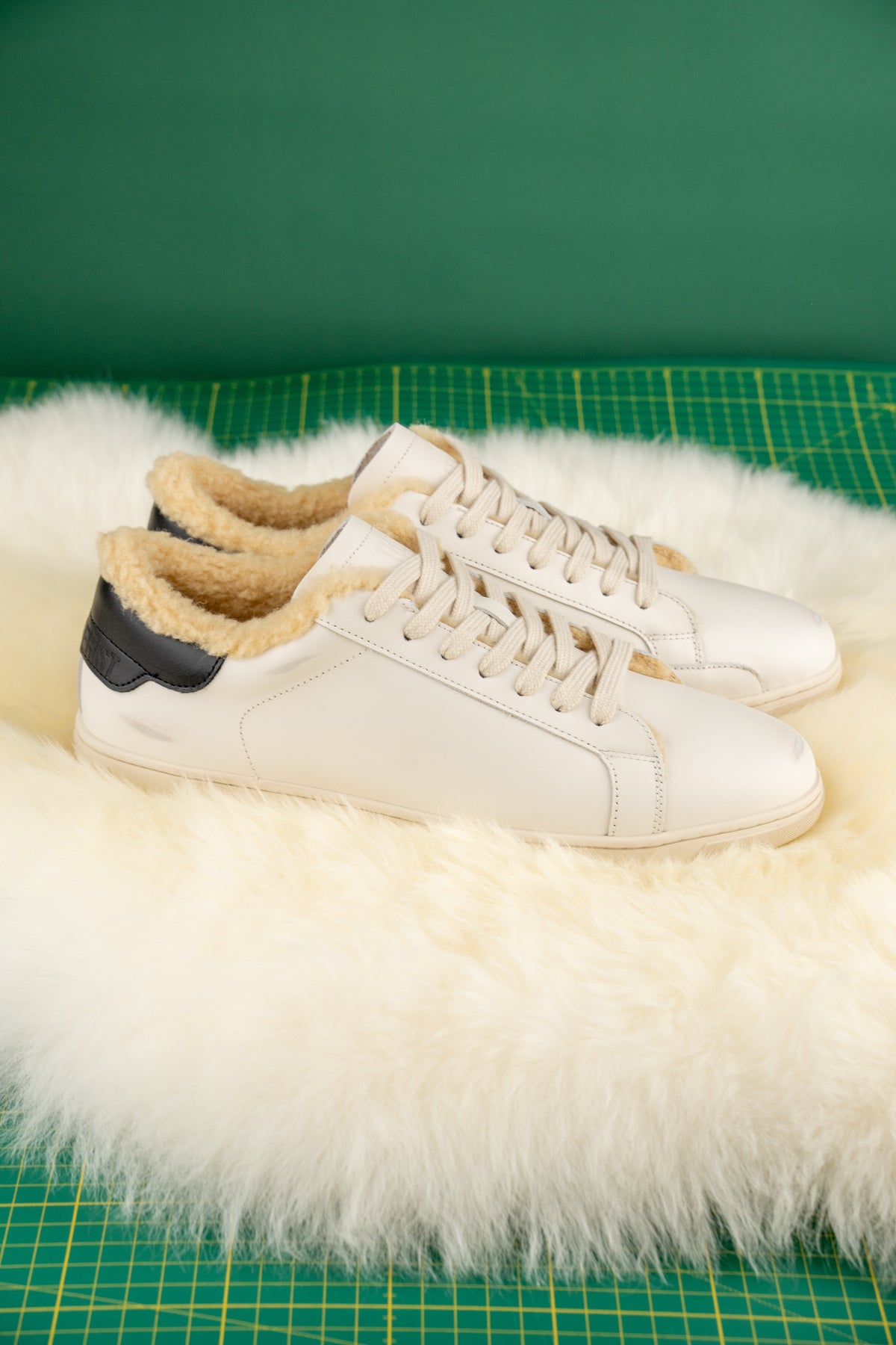 Geneva Wool Black Heel Unsigned, pair on sheepskin