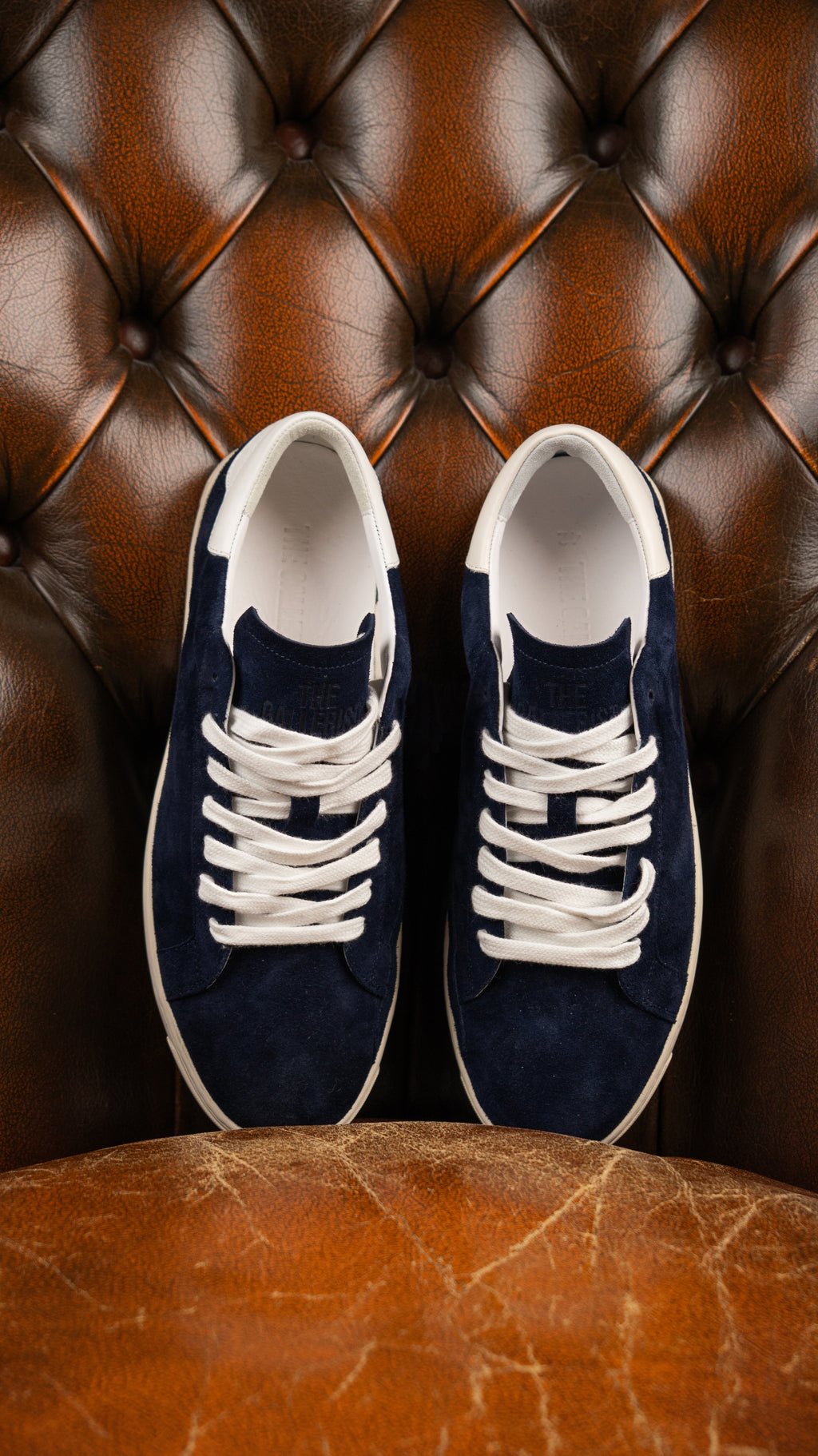 Geneva Dark Blue Unsigned, pair from above on a chesterfield chair